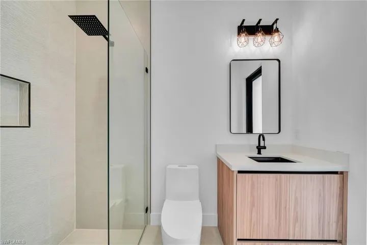 Full bath featuring vanity and a walk in shower