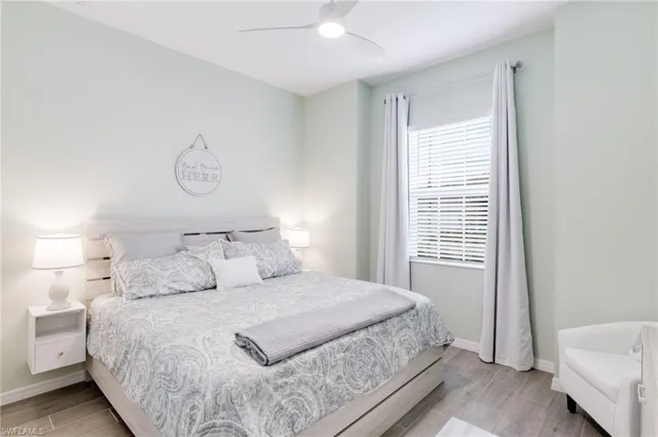 Bedroom featuring ceiling fan and light wood-type flooring