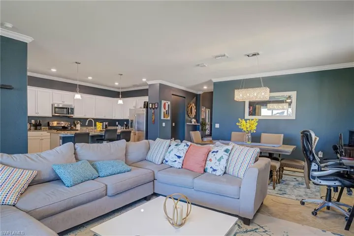 Open concept living area featuring a kitchen, dining space, and living room