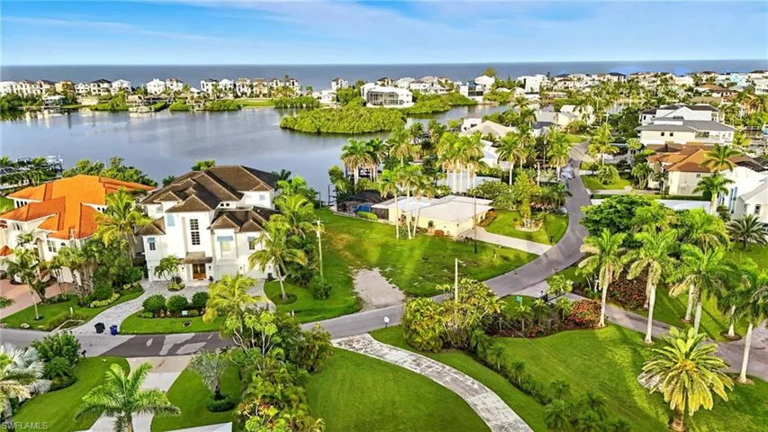 Aerial perspective of suburban area with a large body of water