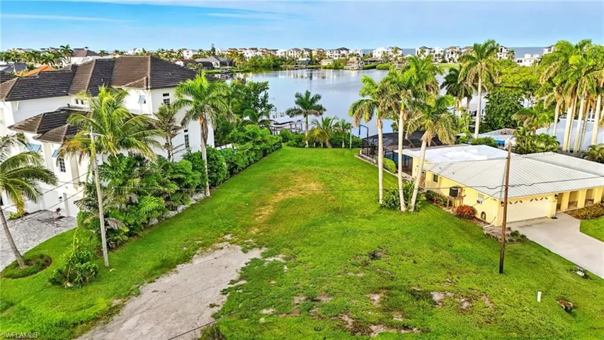 Aerial view of residential area with a large body of water