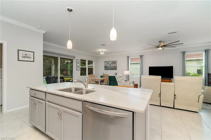 A substantial island and breakfast bar with even more cabinets