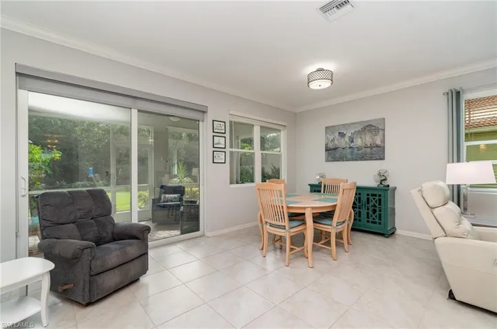 The dining area with a view of the preserve in the backyard