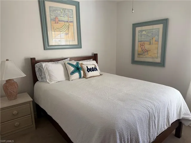 Bedroom with dark carpet