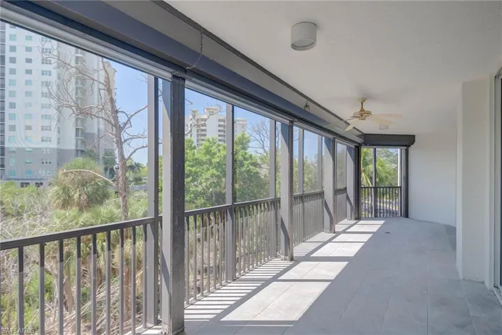 New Tiled  Balcony sunroom w/ceiling fan and a balcony and Screen at the End