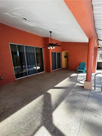 View of patio featuring a ceiling fan