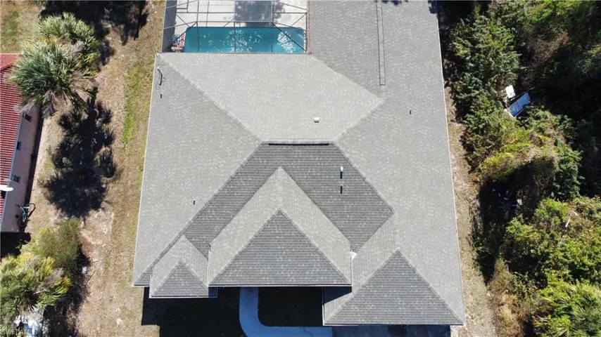 View of subject property with a pool area