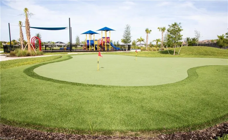 View of home's community featuring a putting area