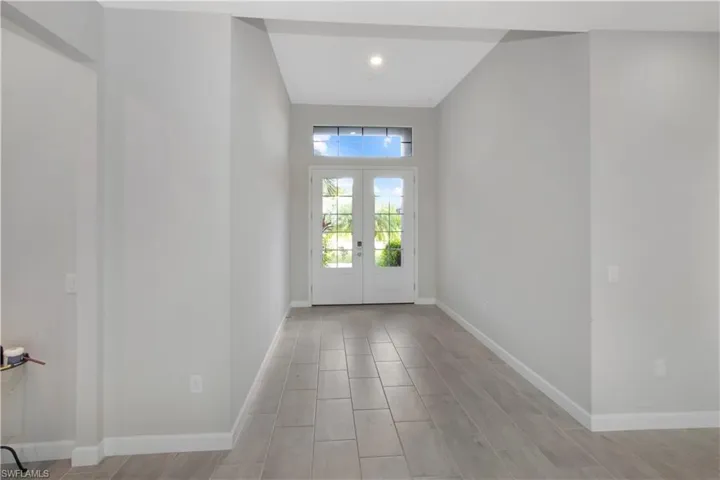Entryway featuring wood tiled floors and french doors