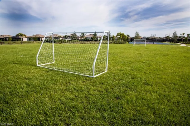 Surrounding community featuring a sport area and a residential view