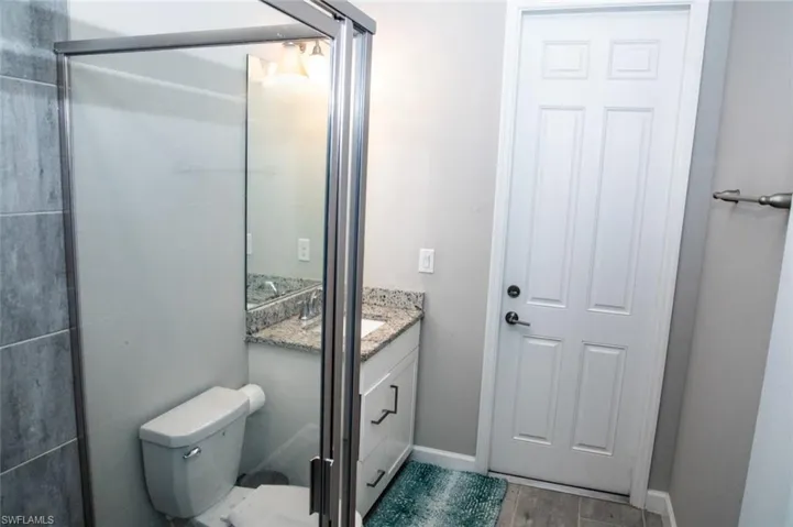 Bathroom featuring vanity and wood finished floors