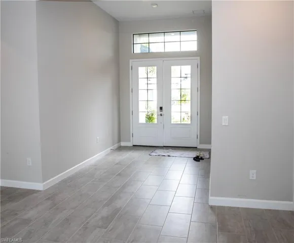 Foyer featuring baseboards