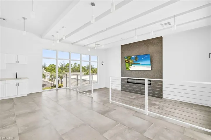 Building lobby with a sink and beamed ceiling