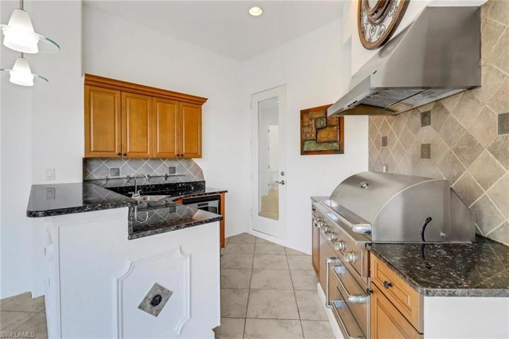 Bar area with wine refrigerator, and mini fridge