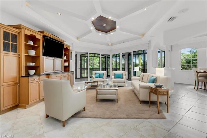 Open concept family room with built-ins and custom ceiling
