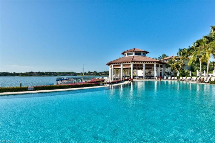 Community pool and spa with clubhouse and outdoor dining area