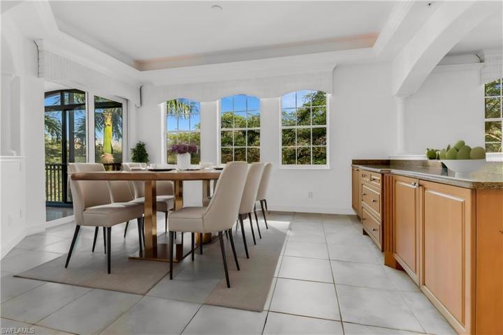 Formal dining room with built-in buffet tray ceiling with crown molding