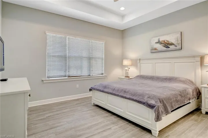 Bedroom with light hardwood / wood-style floors