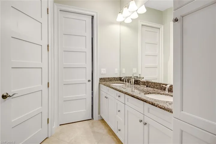 Bathroom featuring vanity and tile patterned flooring