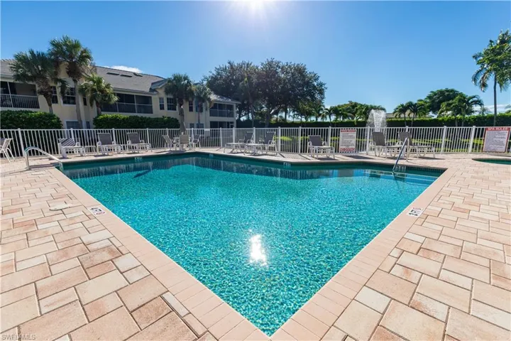 Community pool featuring a patio