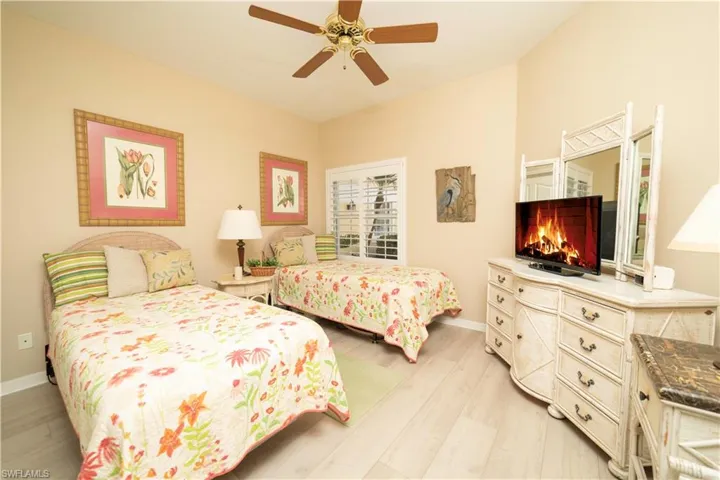 Bedroom featuring light wood-style flooring and ceiling fan