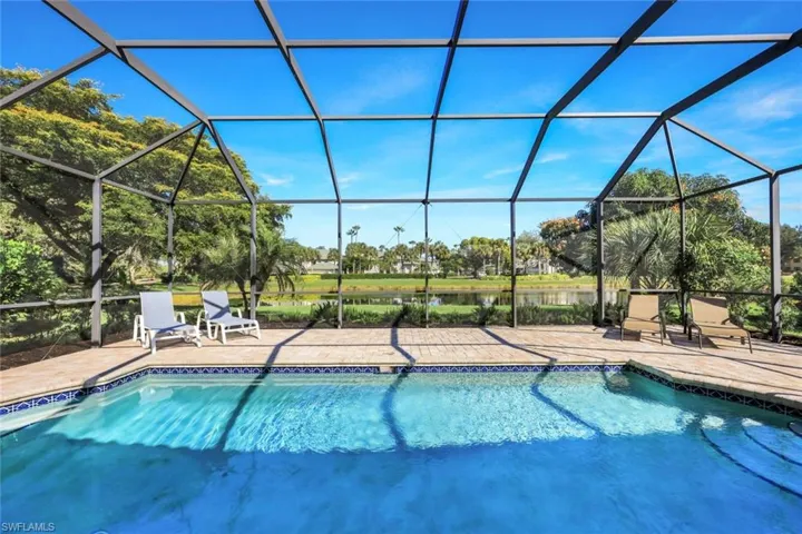 Outdoor pool with a sunroom, a lanai, and a patio area