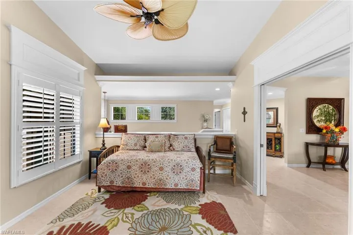 Bedroom featuring ceiling fan and light tile patterned floors