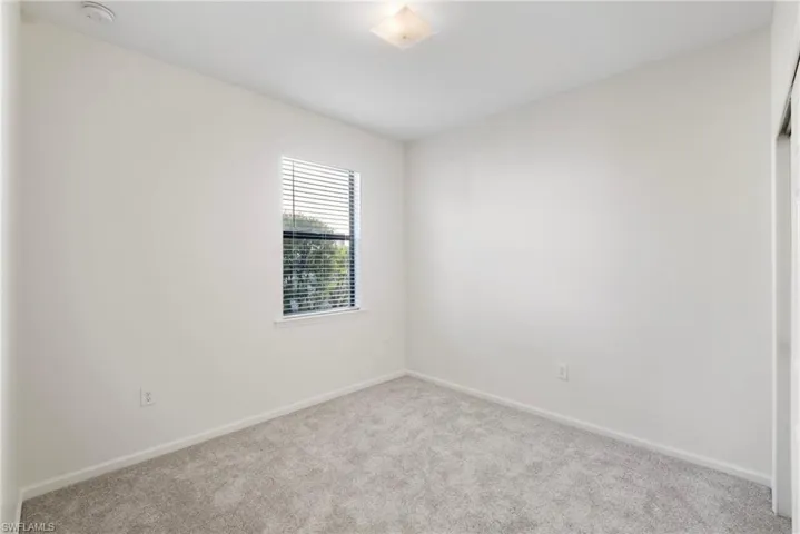 Spare room featuring carpet