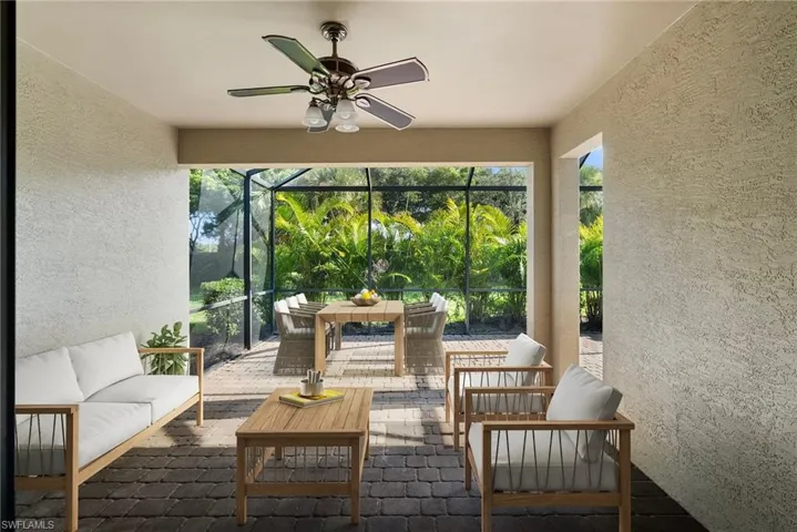 Sunroom featuring ceiling fan