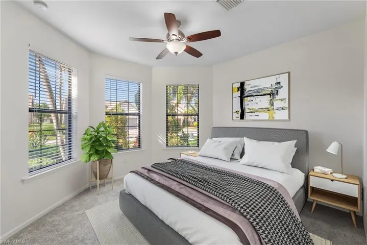 Bedroom featuring ceiling fan and light colored carpet