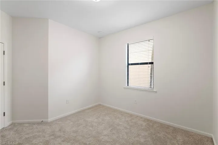 Empty room featuring carpet flooring