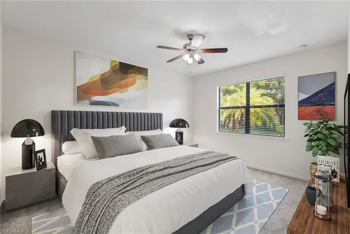Bedroom featuring ceiling fan and carpet floors