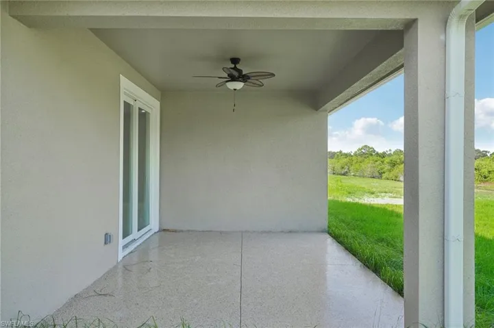 View of patio featuring ceiling fan