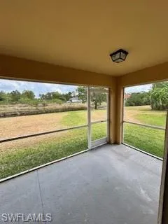 Unfurnished sunroom featuring carpet flooring