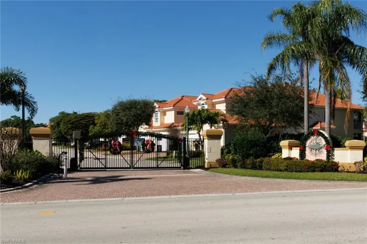Gated entrance to Tarpon Gardens decorated for holiday season.