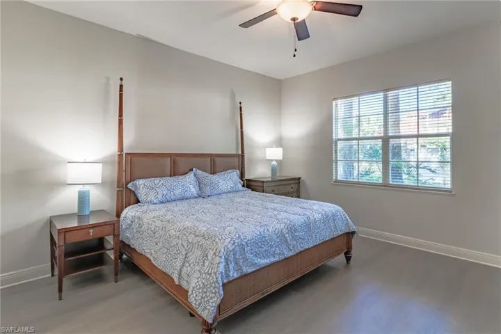Very spacious Primary bedroom with sliding glass doors to screened lanai