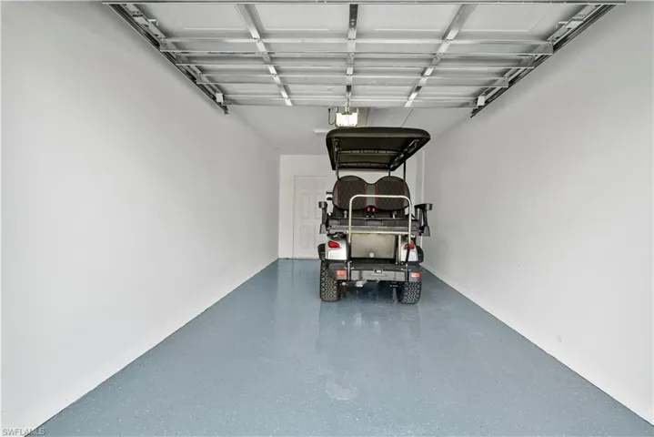 Garage featuring a garage door opener