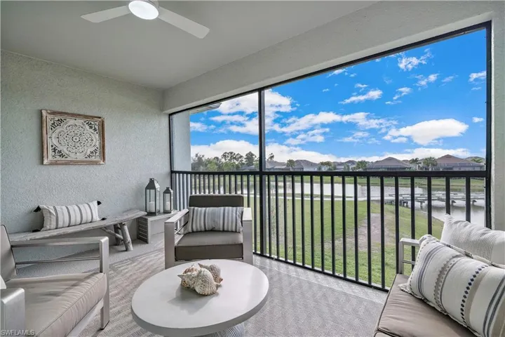 Sunroom featuring ceiling fan