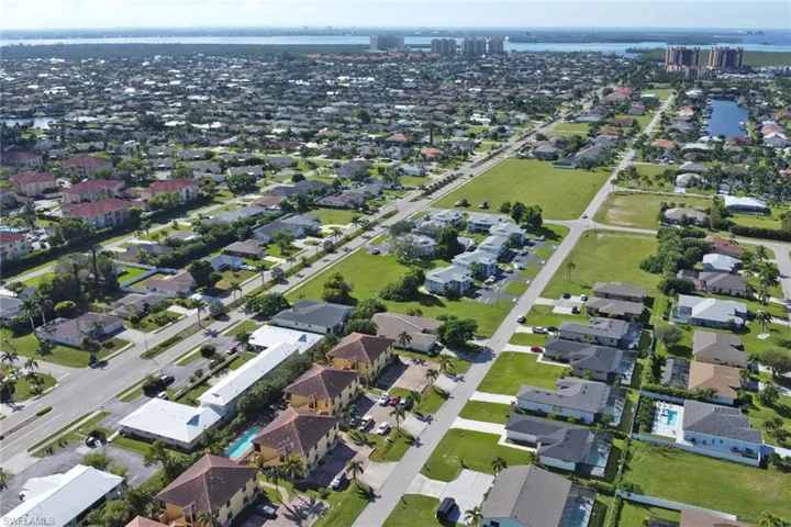 Aerial view of condo building with Tarpon Point and Cape Harbour in the distance