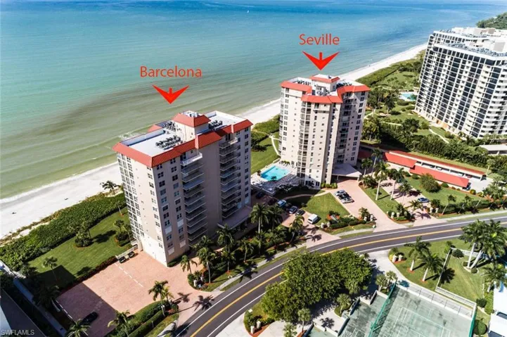 Bird's eye view of waterfront with a beach and apartment complex / building