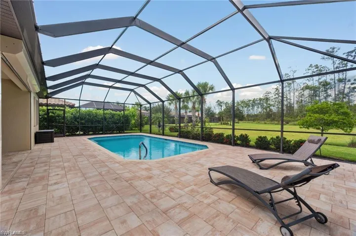 large pool deck with a saltwater pool