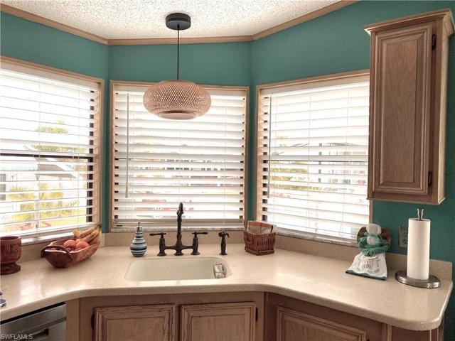 Triple window over Triple Window over Dbl Kitchen Sink on Front of Home