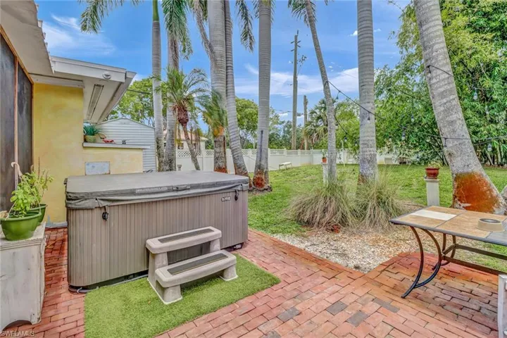 View of patio featuring a hot tub