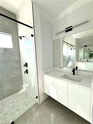 Bathroom with vanity and an enclosed shower
