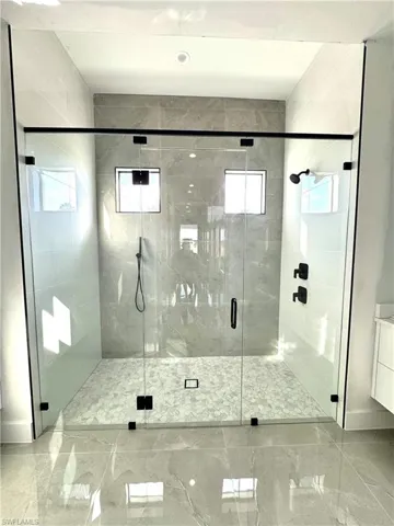Bathroom with vanity and an enclosed shower
