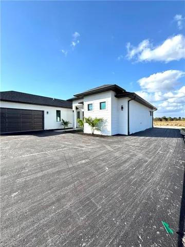 View of side of property  featuring private road
