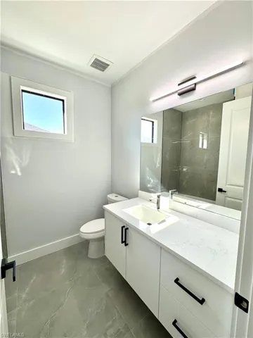 Bathroom with vanity and toilet