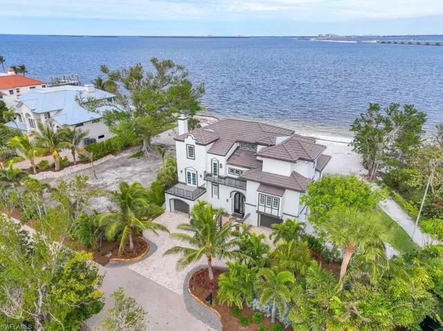 Drone / aerial view featuring a water view and a beach view