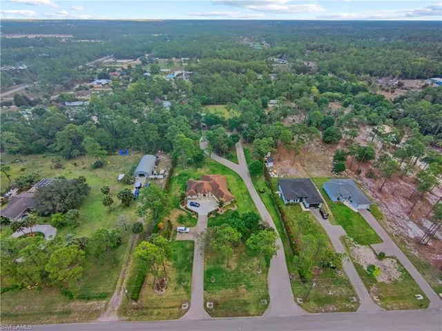Aerial view of property's location featuring nearby suburban area