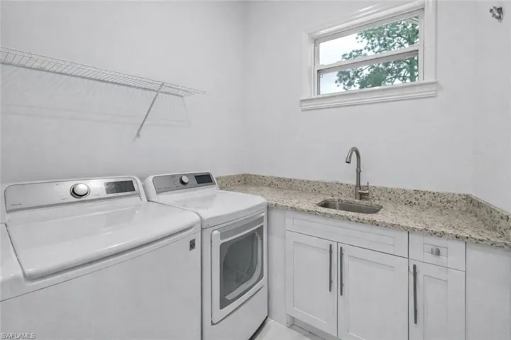 Laundry room with washer and dryer and cabinet space